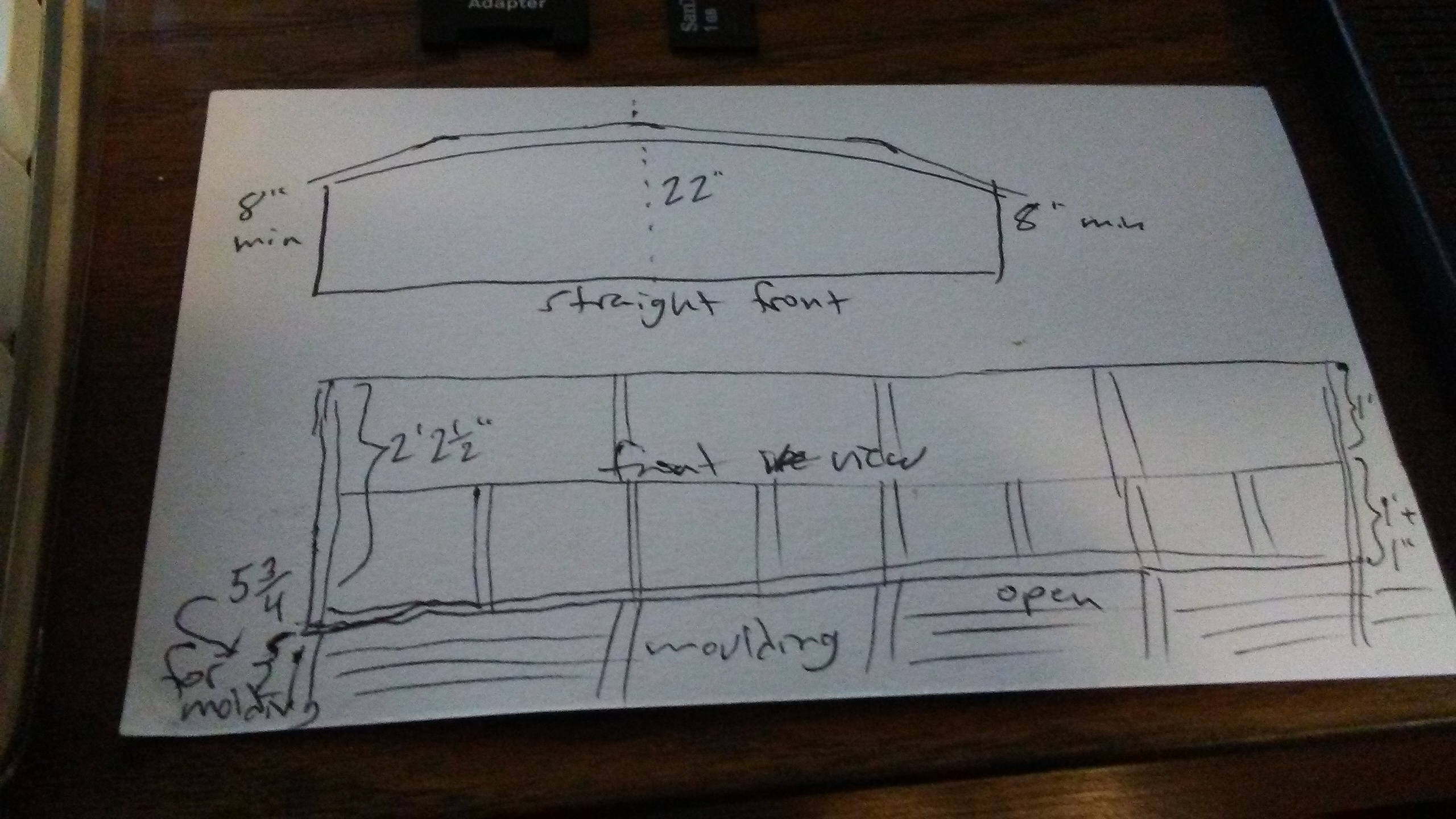 a rough sketch of a wide, low bookcase